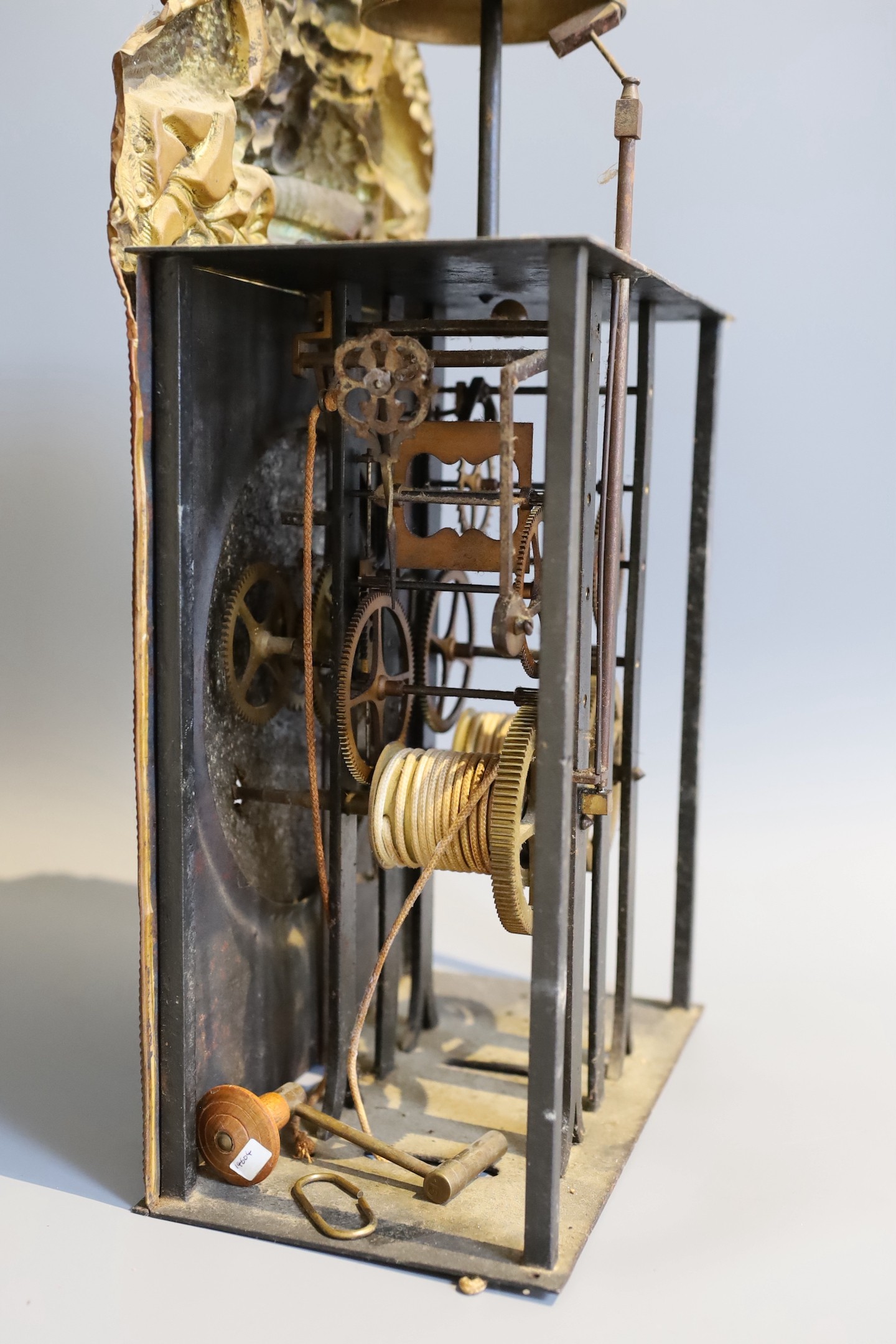 A 19th century French eight day longcase clock movement, with circular enamelled dial, pendulum and weights